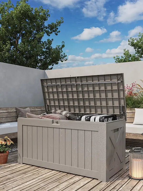a khaki 120 gallon outdoor storage deck box standing in the patio